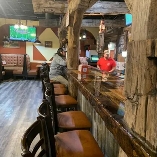 The bar in the back. Rustic, but really cool.