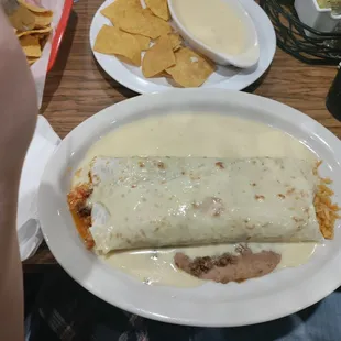 a burrito and chips on a table