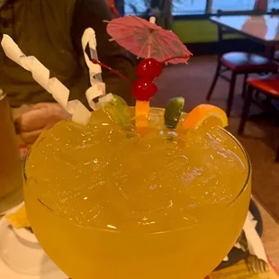 a drink with a straw umbrella
