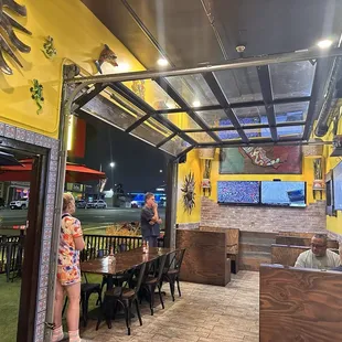 Garage door opens up the restaurant making the restaurant look a little bigger