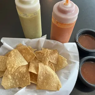 Chips, salsa verde, salsa roja(HOT) and mild red sauce.