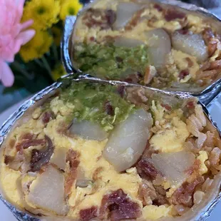 Bacon breakfast burrito with added rice and guacamole
