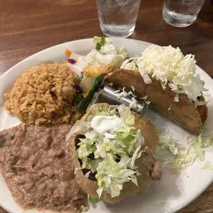 Sope of asada with a crunchy taco of chicken. Rice and beans