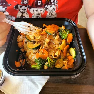 This was a bowl of rice for $14. Rice veggies and tiny piece of rubbery chicken..