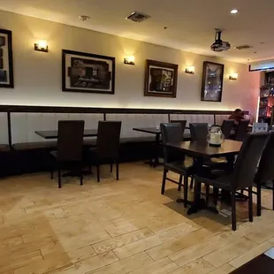 a restaurant with tables and chairs