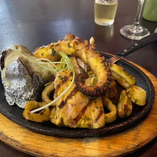 Seafood mix . Mussels , octopus, mahi mahi, potato.