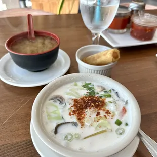 a bowl of soup and a glass of water