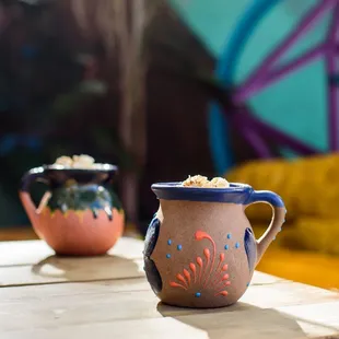two coffee mugs on a table