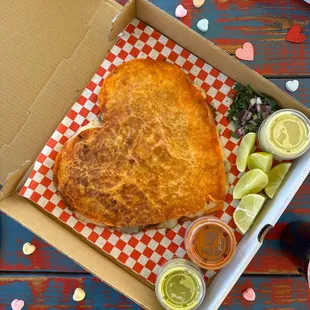 Our limited time only Heart-shaped Pizza Birria. 3 heart-shaped layers each filled with birria and melted cheese.