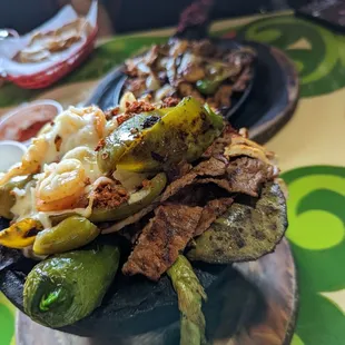 Molcajete for 1 in the front, fajitas mixtas for one in the back