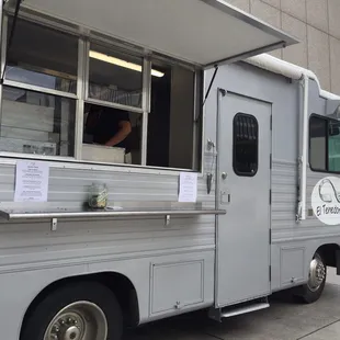 a food truck parked on the side of the road
