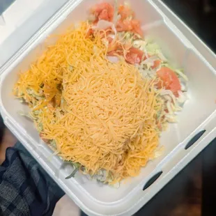 2 Beef taco ninjas under all that cheese. Served a la cart.