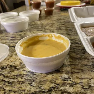 A cup of queso when we ordered a bowl and cost us about $7.00.