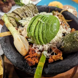 Classic molcajete (chorizo, shrimp, onions below, steak on the side)