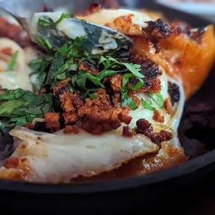 The toasty bottom of the queso fundido