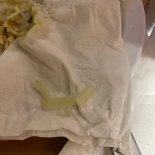 a piece of paper on a cutting board with a knife