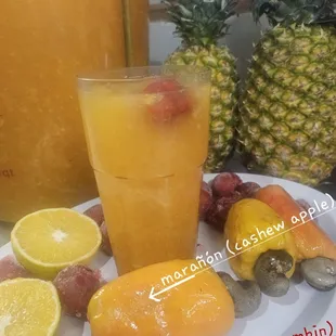 a plate of fruits and juice