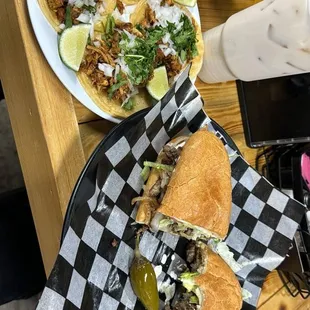 two tacoss on a table