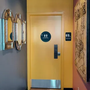 a hallway with a yellow door