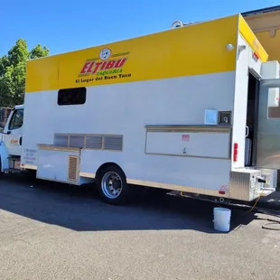 a food truck parked on the side of the road