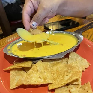 Spoon found in bottom of queso.