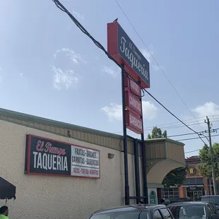 cars parked in front of a restaurant