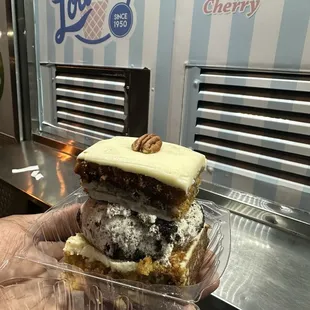 Carrot cake with a scoop of cookies and cream ice cream
