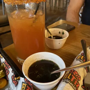 a bowl of soup and a drink