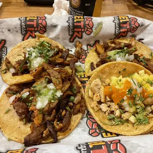 three tacos on a tray