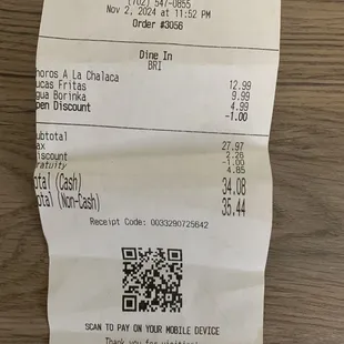 Receipt - $1 was credit for overcharge; you could see $4.99 For a simple bottle of water; You can see dining time, 11:52 PM and the rest