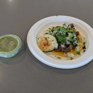 Asada taco with green sauce. Quite soggy, and the meat was kind of tough to chew. Great otherwise!