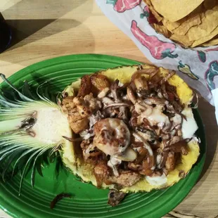 Pineapple with steak, chicken and shrimp.