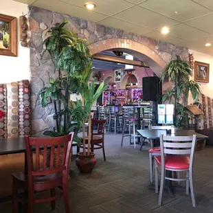 Inside the restaurant. Dining shot into bar area.