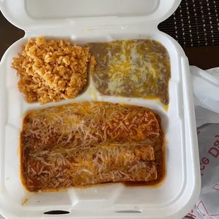 2 chicken enchiladas with beans and rice. Chicken enchiladas we pretty good, but the rice and beans were no way homemade.