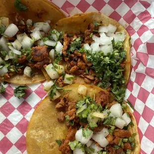 Taco plate with a side of beans.