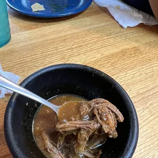 Meaty consommé for the Birria tacos.