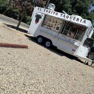 a food truck parked on the side of the road