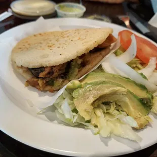 a plate with a sandwich and salad