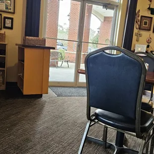 a conference room with chairs and a podium