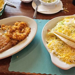 two plates of mexican food on a table