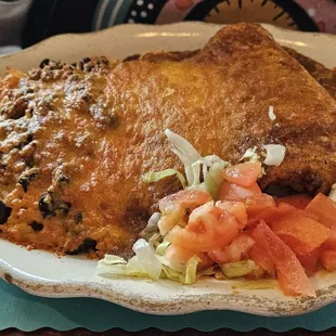 a plate of mexican food on a table