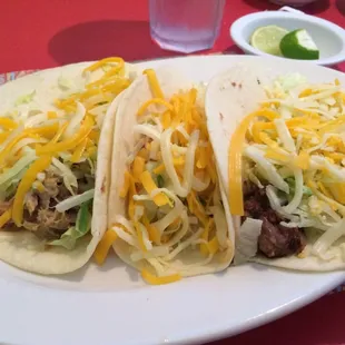 Shredded beef, chicken &amp; shredded pork tacos