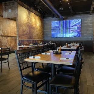 a dining area with tables and chairs