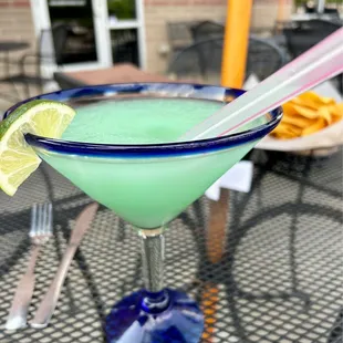 a margarita with a lime slice on the rim