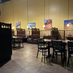 a restaurant with tables and booths