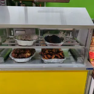 Today's specials (November 2, 2019) Top- BBQ Chicken, Pork Ribs, Bottom - Roast Pork (Carnitas), Chicharrones (Deep fried pig skins)