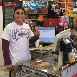a man standing in front of a cash register
