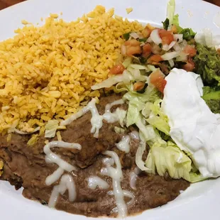 a plate of mexican food with rice and beans