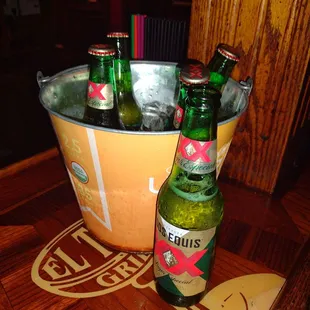 two bottles of beer in a bucket