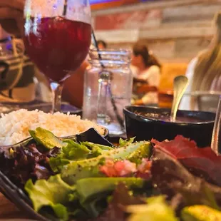 a plate of food and a glass of wine